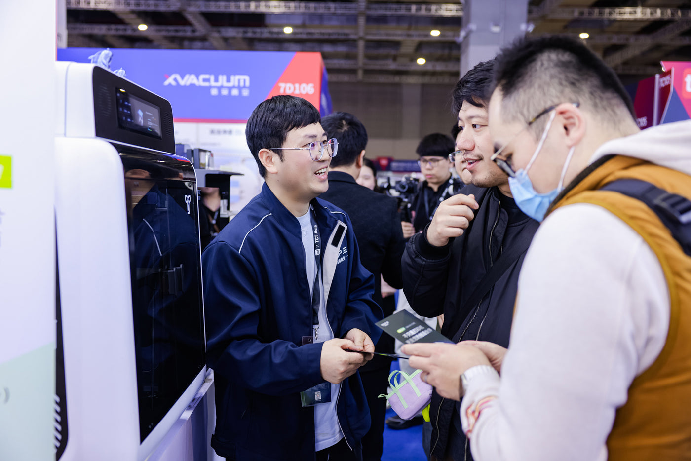 TOP.E team speaking with visitors at TCT Asia